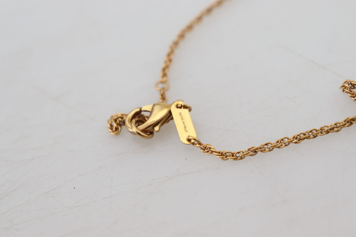 Elegant Gold Tone Charm Necklace with Cross Pendant